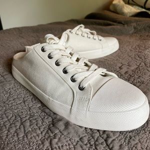 White canvas sneaker slides